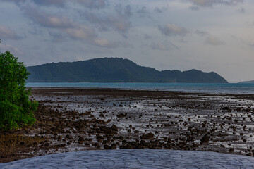 Sunset Beautiful view from Kao Khad next to Cape Panwa on the island of Phuket Thailand. Views of the turquoise Blue waters of the Andaman Sea and small islands off the coat of Phuket