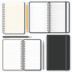 Collection of open and closed spiral notebooks with pencils and pens