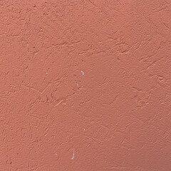 Textured salmon-colored wall