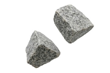 Two pieces of shattered stones dropping against a white background