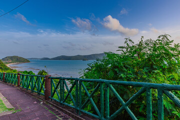 Obraz premium Sunset Beautiful view from Kao Khad next to Cape Panwa on the island of Phuket Thailand. Views of the turquoise Blue waters of the Andaman Sea and small islands off the coat of Phuket