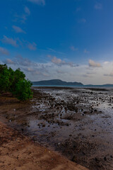 Sunset Beautiful view from Kao Khad next to Cape Panwa on the island of Phuket Thailand. Views of the turquoise Blue waters of the Andaman Sea and small islands off the coat of Phuket