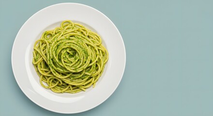 Plate of Freshly Cooked Green Spaghetti without Sauce on a Light Blue Background