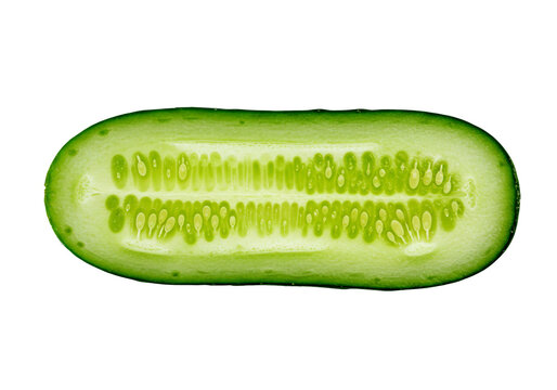 Fresh green cucumber cut lengthwise isolated on white background