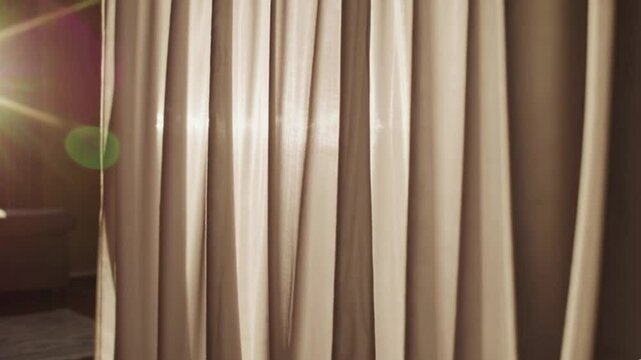 Semi-transparent curtains gently swaying in the breeze