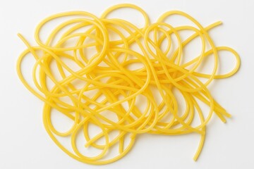 A plate of yellow pasta on a plain white backdrop, showcasing Italian cuisine essentials
