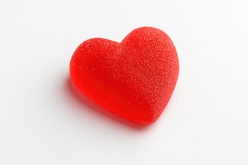 Fototapeta premium Isolated red heart-shaped sweet piece
