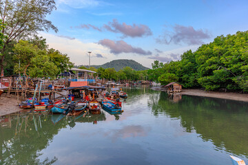 Long tail boats moored in Chalong a small river inlet leading into Chalong Bay in the Andaman sea on the island of hurry Thailand