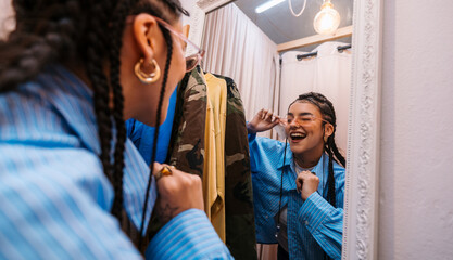 Joyful Reflection A Fashion Enthusiast Enjoys Their Time in the Dressing Room