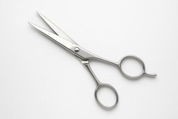 Elegant metallic scissors displayed on a plain white backdrop