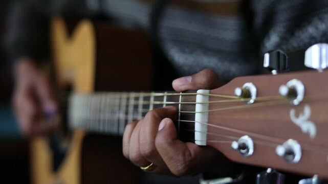A man playing a guitar