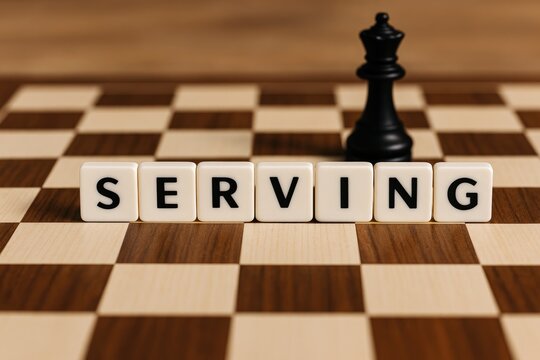 Serving the concept of black & white letter tiles on a chessboard