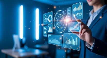 A businesswoman interacts with a futuristic holographic interface displaying data charts and graphs in a blue-lit environment.