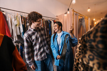 Fashion Lovers Enjoying Themselves at a Charming Vintage Clothing Store