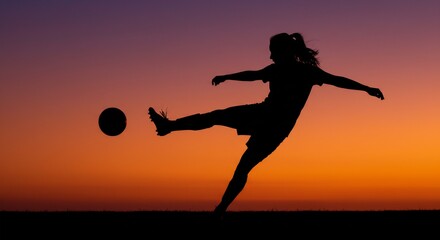 Silhouette of a female soccer player kicking a ball during a vibrant sunset