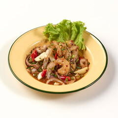 Spicy shrimp salad with fresh herbs, chili, and lime juice served in yellow bowl garnished with lettuce, showcasing vibrant colors and zesty flavor