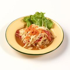 Plate of Thai papaya salad also known as Som Tum served with fresh lettuce. dish features shredded green papaya tomatoes dried shrimp peanuts and chili in tangy spicy dressing