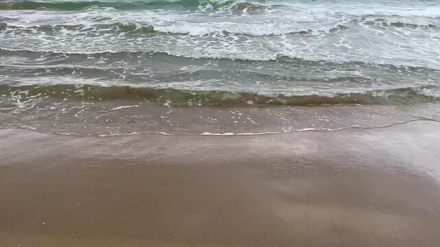 Moody early morning sea with rolling waves
