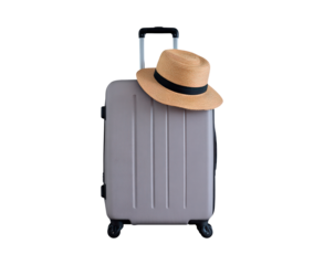 Vacation travel essentials with suitcase and straw hat on transparent background, PNG