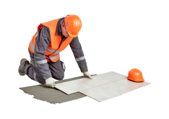 Skilled worker installing floor tiles in construction safety gear on transparent background, PNG