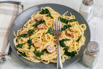 chicken sausage alfredo  served with sauteed  spinach