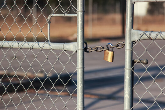 Short chain and lock holding gates shut