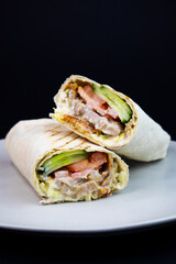 Halved Kebab (Shawarma) Close-Up. Juicy sliced shawarma kebab with tender meat and fresh vegetables, perfect for food blogs and street food marketing