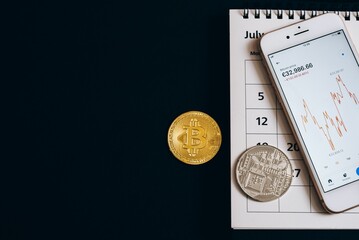 Cryptocurrency coins with a smartphone.