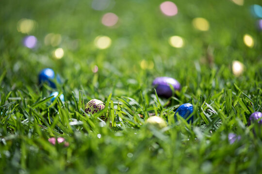 Coloured foil easter eggs in grass