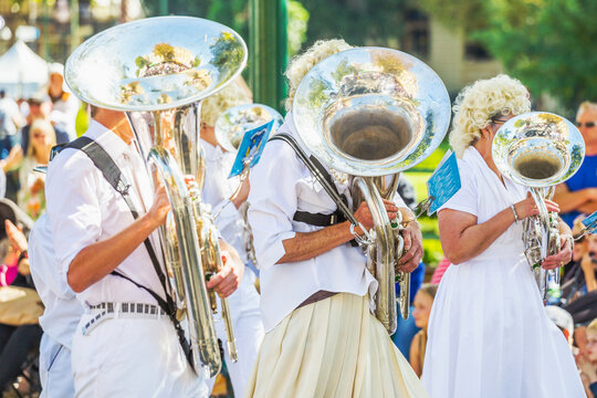 Members of a brass band marching in a parade