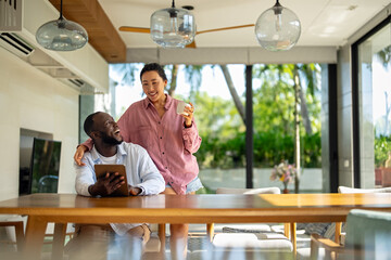 Online entertainment and social media. Diverse, multiethnic couple enjoying the digital world