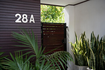 Front entry to stylish home unit with plants
