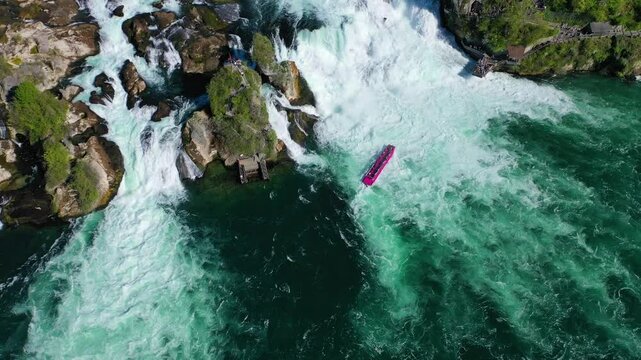 Tourist boat dangerously close to a waterfalls