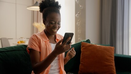 Happy African American business woman female girl businesswoman user winning prize luck smartphone...