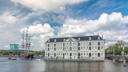 Hyperlapse of the National Maritime Museum with the sailboat replica Amsterdam docked nearby. Amsterdam, Netherlands