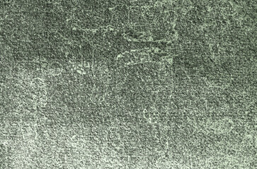 Green textured background creating visual interest with its granular pattern