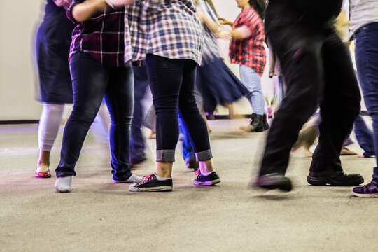 Blurred legs and feet of peopel at a bush dance