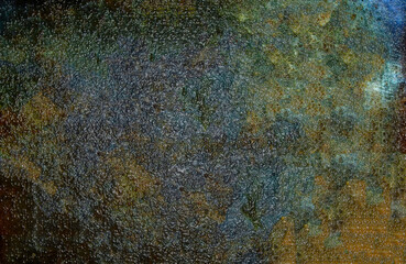 Abstract background showing textured surface with colorful pattern