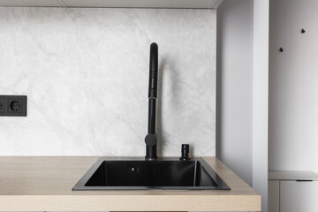 kitchen faucet on a stylish metal sink