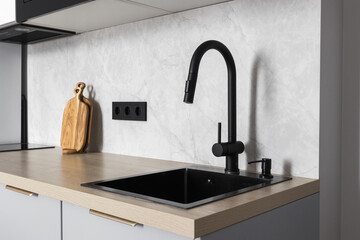 kitchen faucet on a stylish metal sink