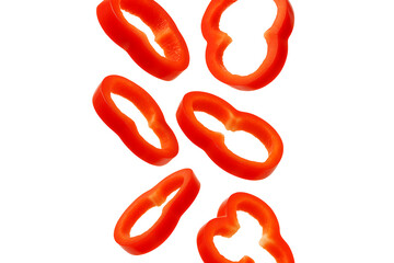 Sliced red bell pepper rings floating isolated on transparent background