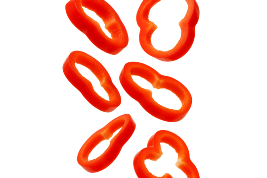Sliced red bell pepper rings floating isolated on transparent background