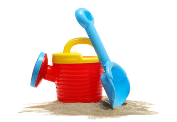 plastic garden toy for kids, watering can and shovel in sand isolated on white background, side view © dule964