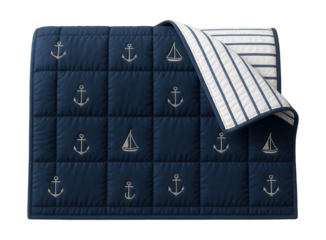 A reversible, quilted bedspread with a nautical theme, ideal for a seaside vacation home bedroom.