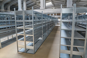 Rows of Empty Metal Shelves in Warehouse