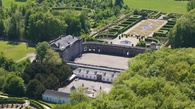 magnificent buildings parks ponds ch&acirc;teau seneffe visitors walking grounds add life to scene reflecting site's popularity left right pans aerial of de 