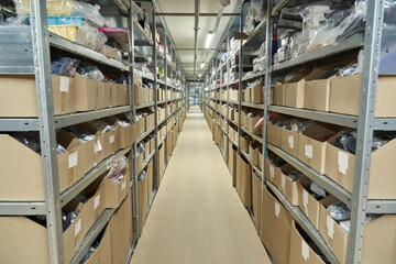 Obraz premium Warehouse Aisle with Organized Shelving and Boxes