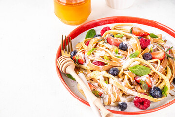 Viral trendy spaghetti pancakes with fresh berries