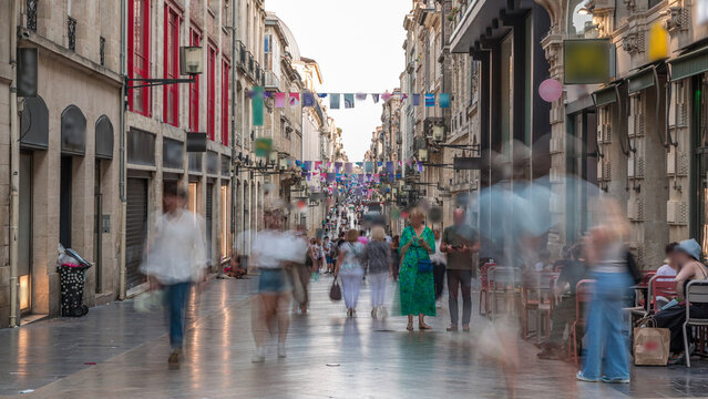 Fototapeta People walking and shopping in Rue Sainte-Catherine timelapse, Bordeaux, France.