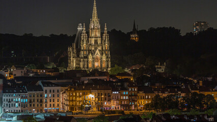 Naklejka premium Aerial view of Notre Dame de Laeken church spires night timelapse in Brussels, Belgium.